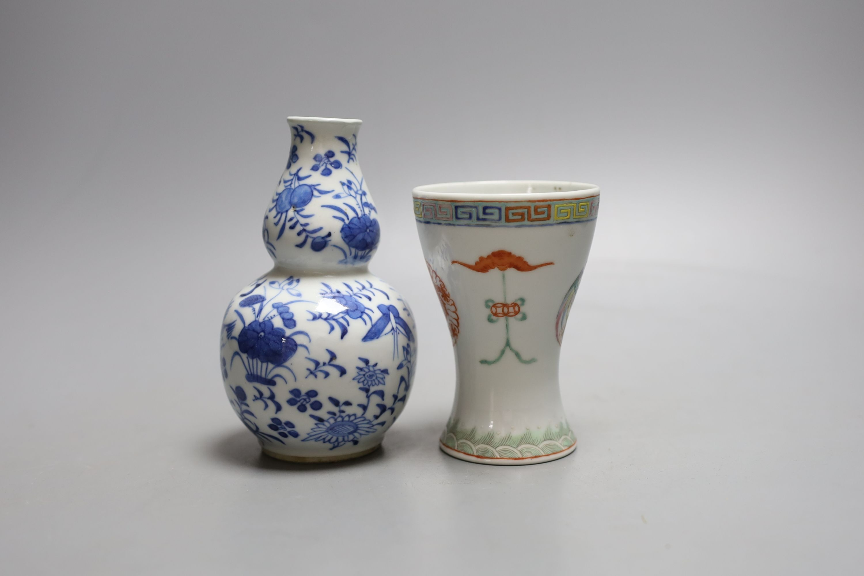 A 19th century Chinese blue and white gourd shape vase and a Chinese cup with inscription on base - tallest 14cm